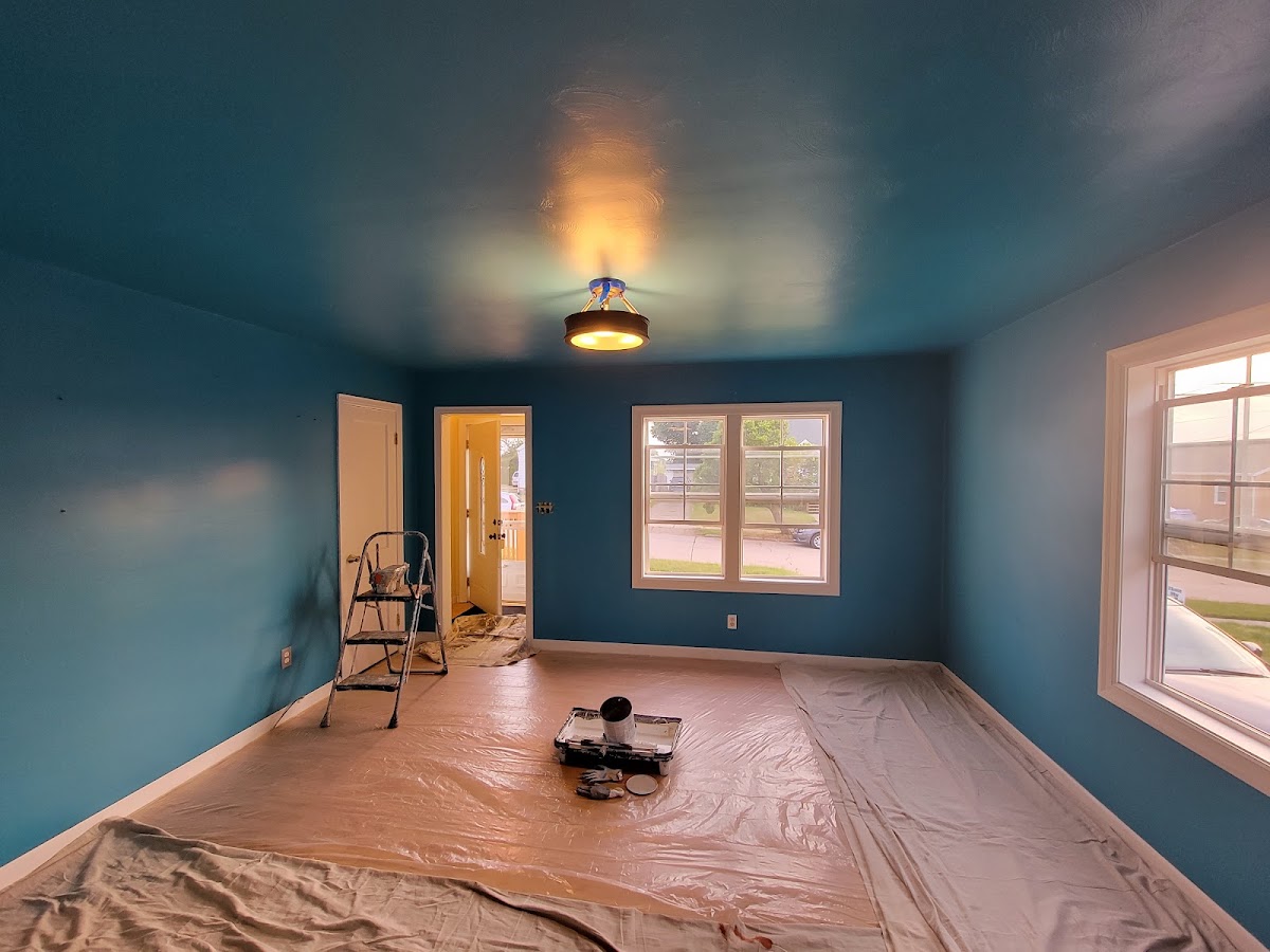 Room covered in drop cloths during painting